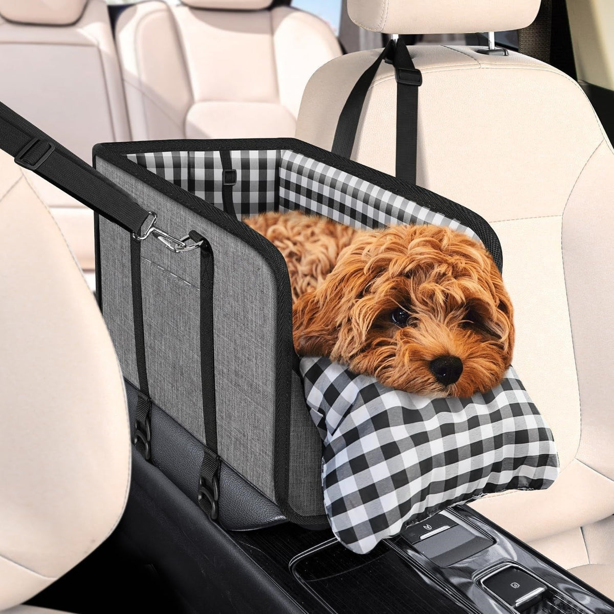 Poodle in the gray center console dog car seat with gingham cushion