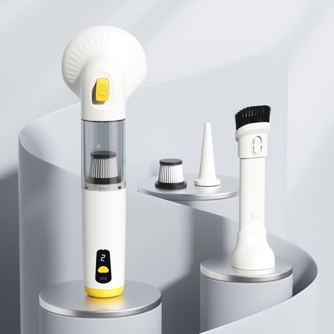 Pet grooming vacuum with yellow trim beside its comb head, filter, nozzle and brush