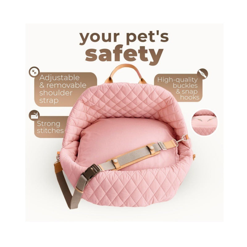 Pink quilted carrier showing adjustable shoulder strap and buckles