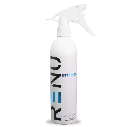 A white spray bottle of RENO Interior cleaning solution with a white trigger sprayer, featuring black and blue branding text on a white background.