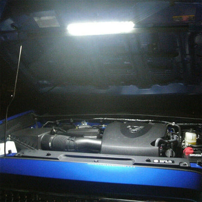 Car engine view with a light on a dark background