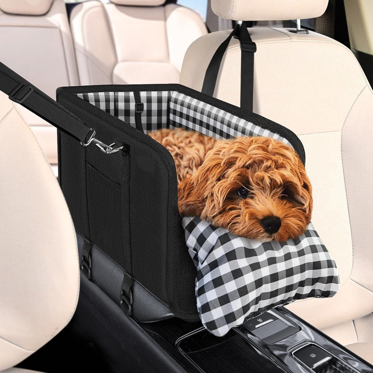 Poodle in the black center console dog car seat with gingham cushion