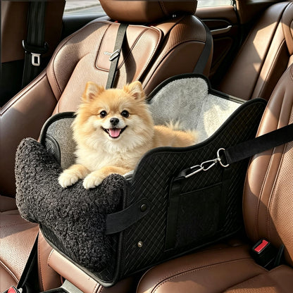 Pomeranian sitting in the black center console dog car seat with plush lining