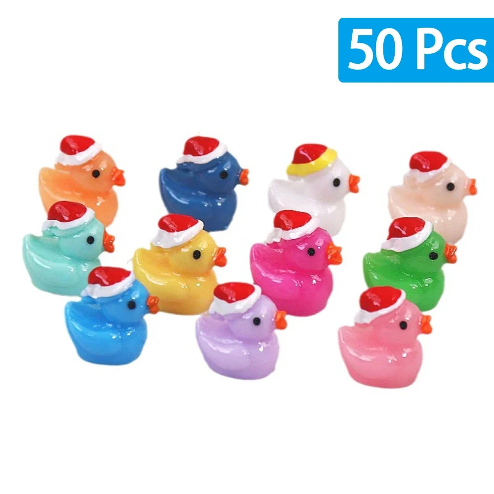 Set of 10 colorful rubber duckies with Santa hats on a white background, labeled '50 Pcs'.