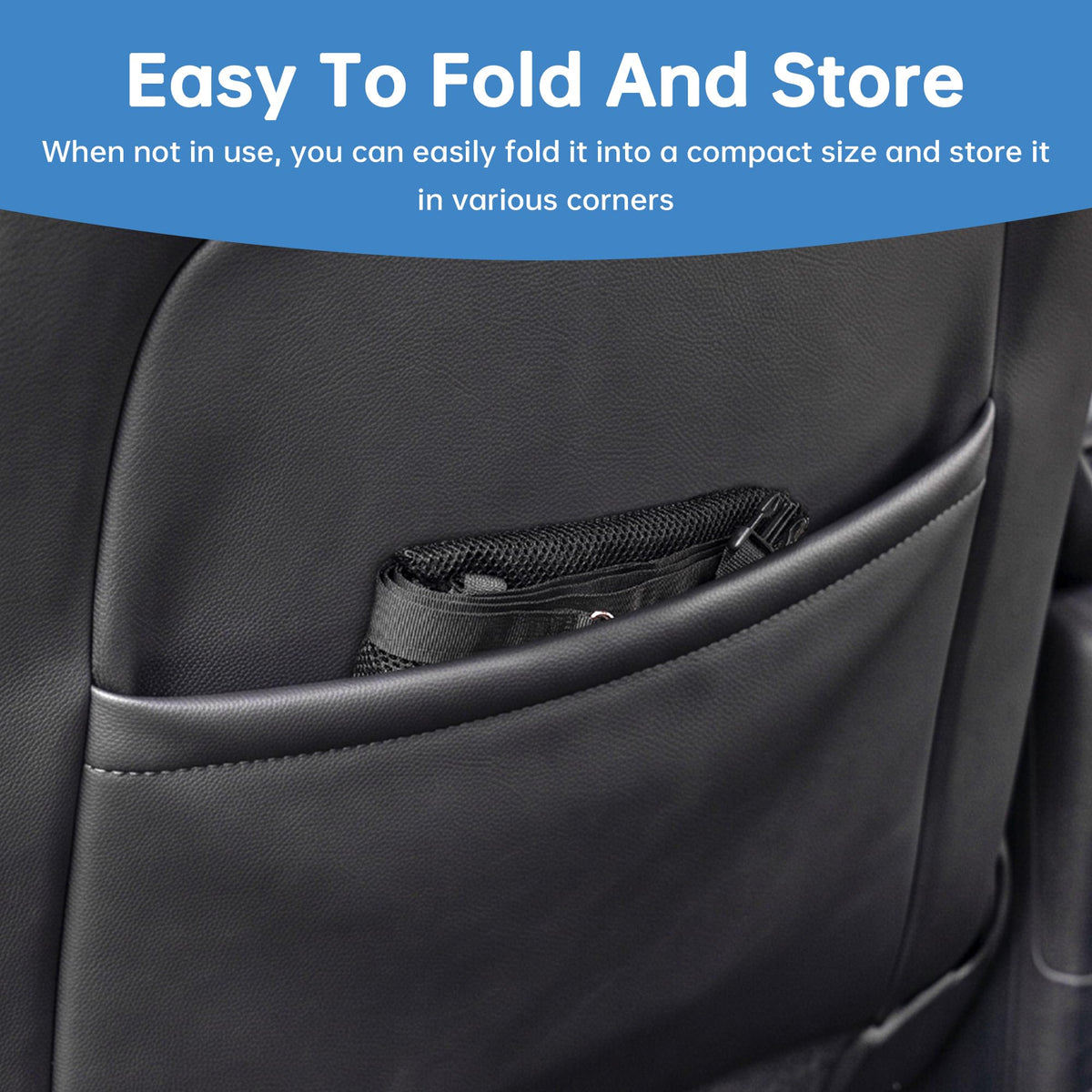 Mesh dog barrier folded into a seat-back pocket for storage