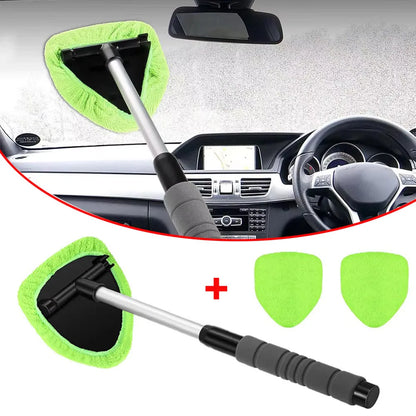 Car cleaning tool with green microfiber pads and additional pads on a car interior background.