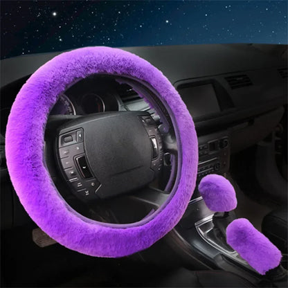 Purple steering wheel cover and gear shift cover on a car dashboard with a starry night sky background.