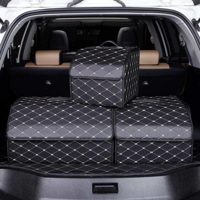 Car trunk with diamond-patterned pet seat covers and a suitcase.