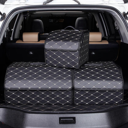 Car trunk with diamond-patterned pet seat covers and a suitcase.