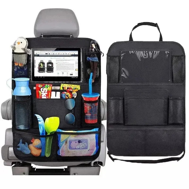 Black car seat organizer bag shown attached to a gray child car seat, with a tablet, cups, sunglasses, toys, and small accessories in the pockets, alongside a second view of the empty bag on a white background.