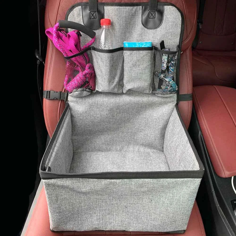Car seat organizer with items on a car seat