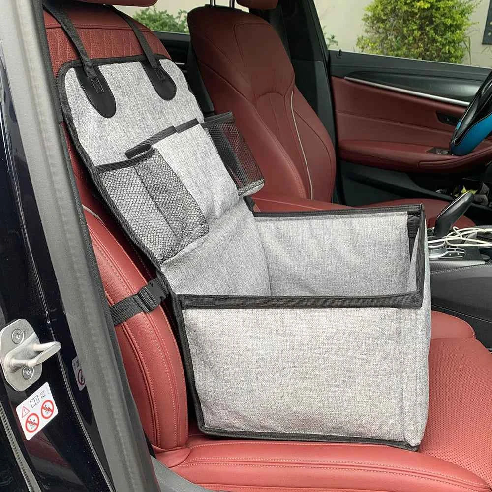 Car seat cover with storage pockets on a red car seat