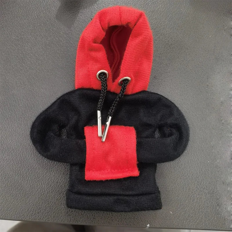 Black and red hoodie on a gray surface