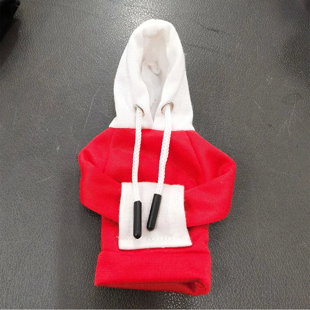 Red hoodie with white lining on a gray surface