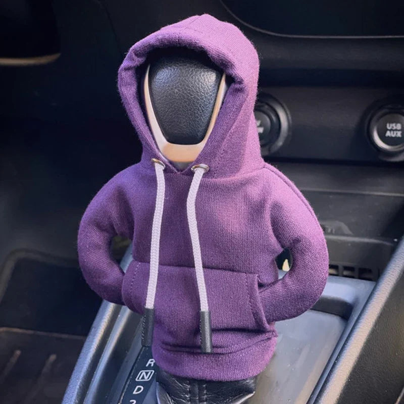 Car steering wheel cover with a purple hoodie on inside a vehicle