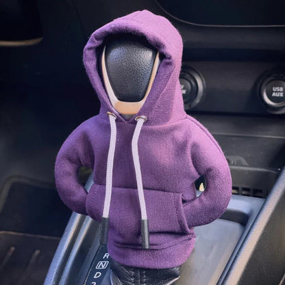 Car steering wheel cover with a purple hoodie on inside a vehicle