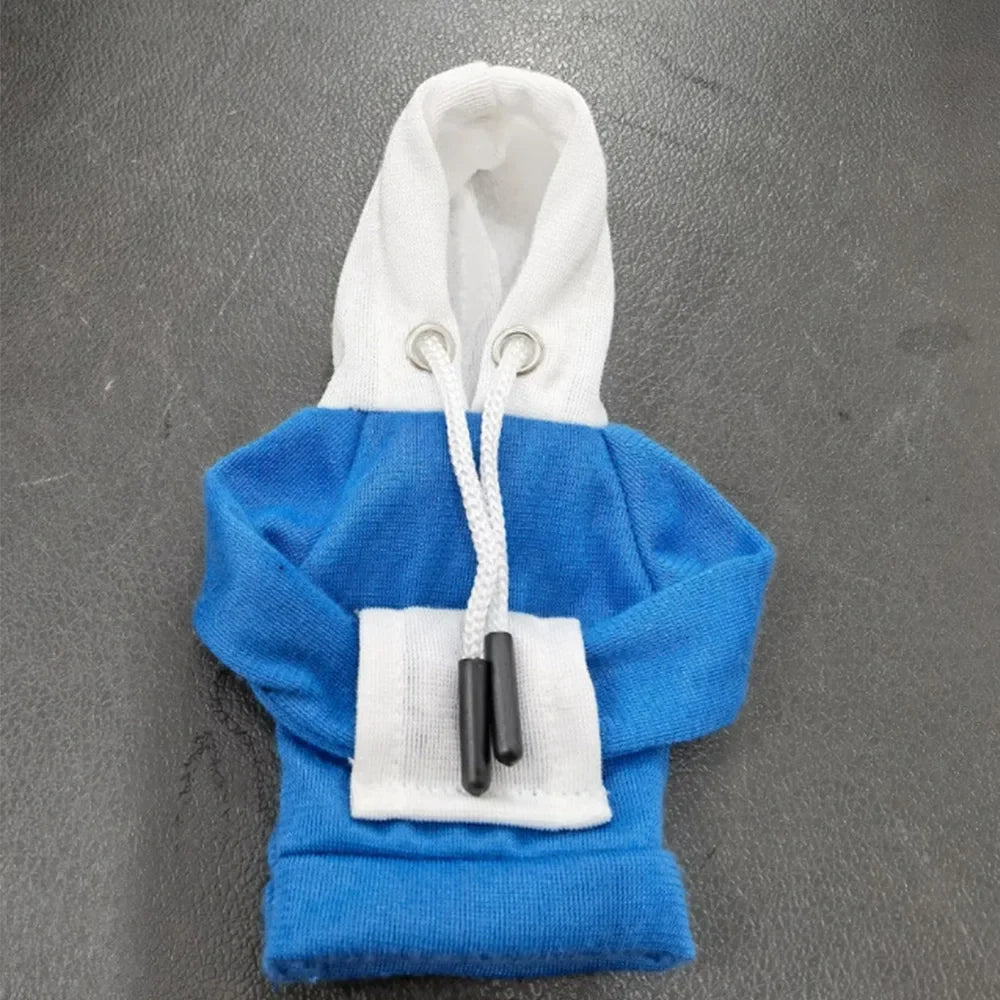 Blue and white hoodie with a pocket on a gray background