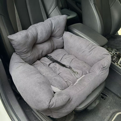 Empty dark gray plush dog seat bed on a car seat with built-in tether