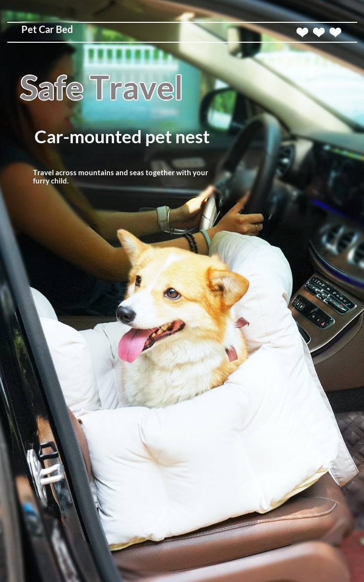Corgi in the quilted seat bed mounted on the front passenger seat