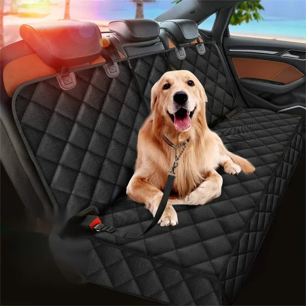 Golden retriever on the black quilted dog hammock in a back seat, clipped to a tether