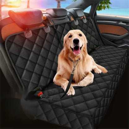 Golden retriever on the black quilted dog hammock in a back seat, clipped to a tether