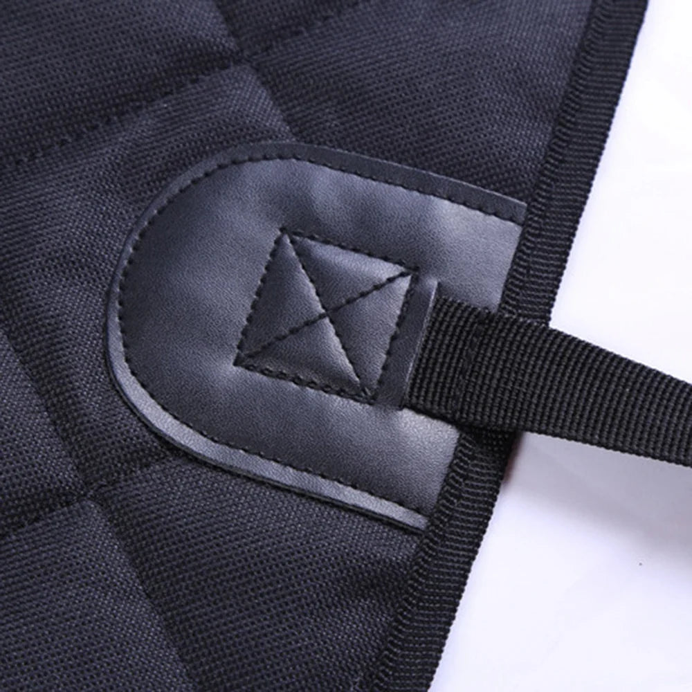 Close-up of the strap and reinforced tab on the black Oxford cloth seat cover