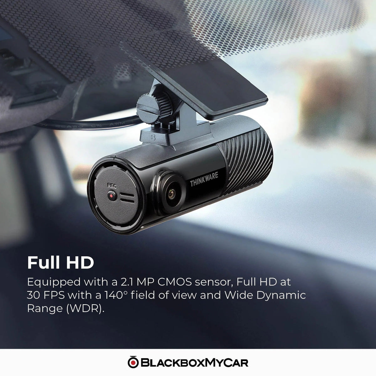 Car dashboard camera with text about specifications and brand on a blurred car interior background