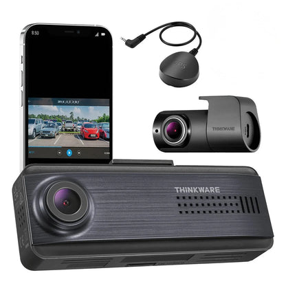 Thinkware dashboard camera system with smartphone app on screen, phone, and additional camera on white background