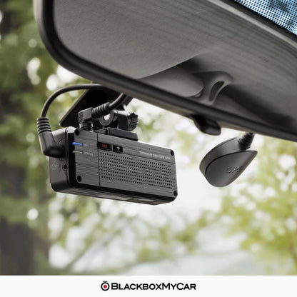 Car dashboard camera mounted on a car's rearview mirror with 'BlackboxMyCar' branding.