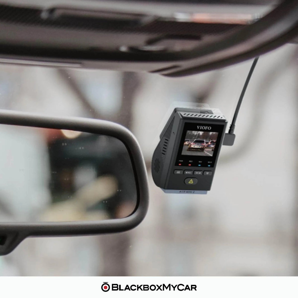 VIOFO A119 Mini 2 installed on a windshield beside the rear-view mirror